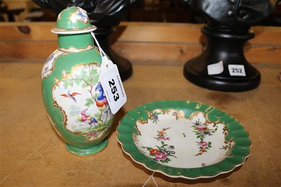 A Worcester green ground polychrome ovoid tea caddy and cover and a similar scalloped dish, c.1780, 15.5cm, both unmarked(-)